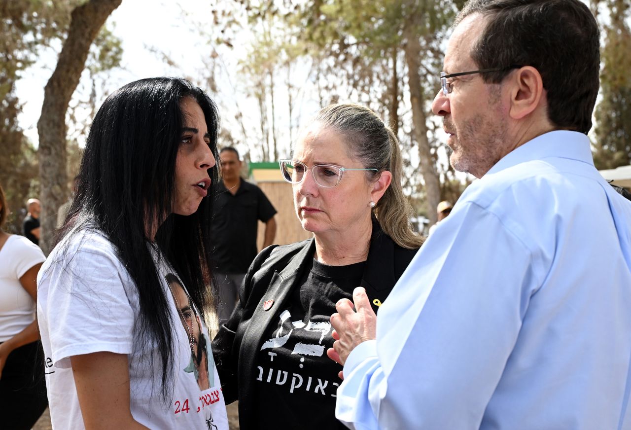 President of Israel Isaac Herzog and First Lady of Israel Michal Herzog, right and center, speak with released hostages from Kibbutz Nir Oz ahead of a ceremony to mark the first anniversary since the Hamas attacks on Israel.