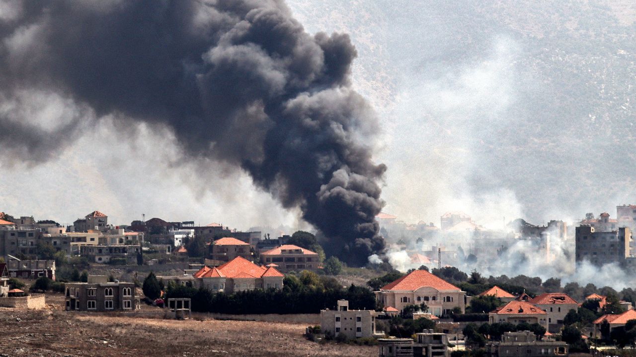 A plume of smoke billows following an Israeli air strike on the village of Khiam in southern Lebanon on Monday.