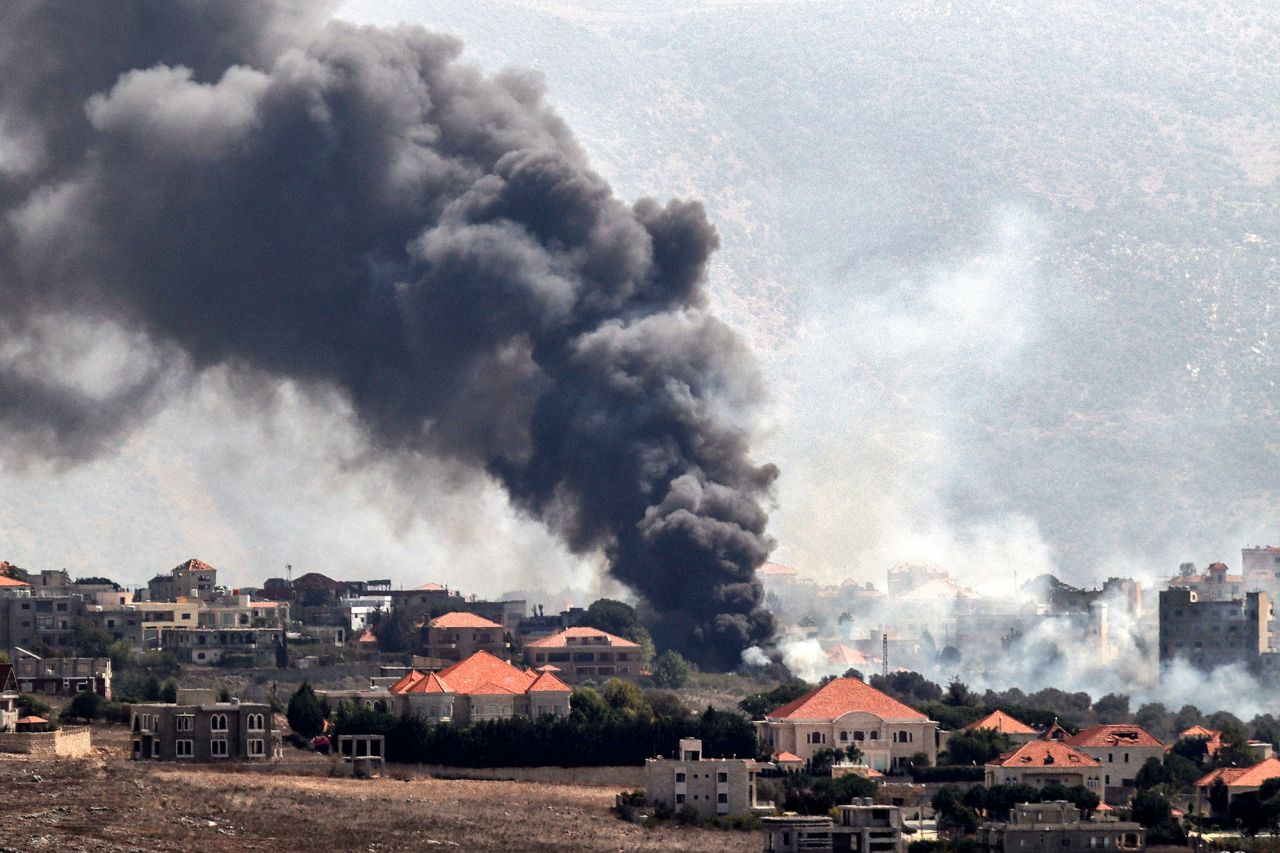 A plume of smoke billows following an Israeli air strike on the village of Khiam in southern Lebanon on Monday.