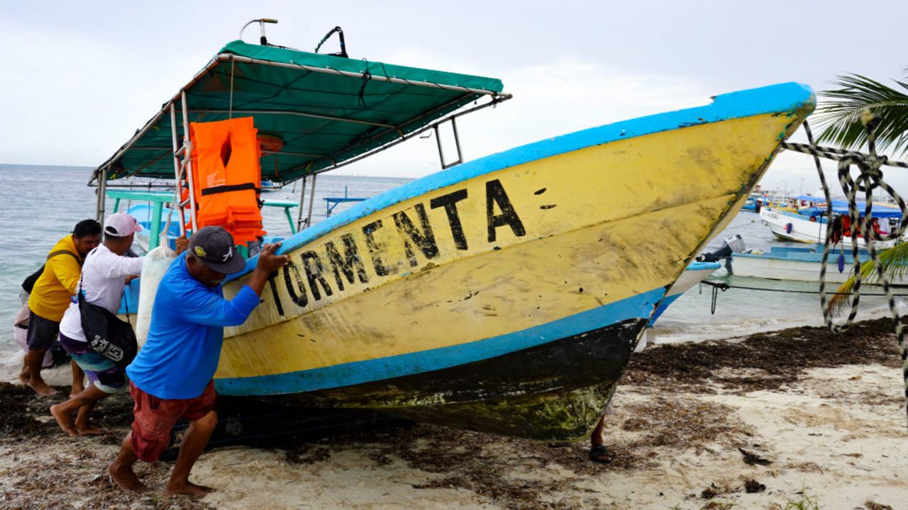 Fishermen and tourism workers take their boats out of the sea as a precaution before the age of Hurricane Milton in Puerto Juarez, Quintana Roo State, Mexico, on October 7, 2024. Hurricane Milton exploded in strength Monday to become a potentially catastrophic Category 5 storm bound for Florida, threatening the US state with a second ferocious storm in as many weeks. Milton, which is also forecast to graze Mexico's Yucatan peninsula as it churns eastward, rapidly intensified to the highest category on a scale of five, triggering evacuation orders and alarms about a life-threatening storm surge in major population centers, including Tampa Bay. (Photo by Elizabeth RUIZ / AFP) (Photo by ELIZABETH RUIZ/AFP via Getty Images)