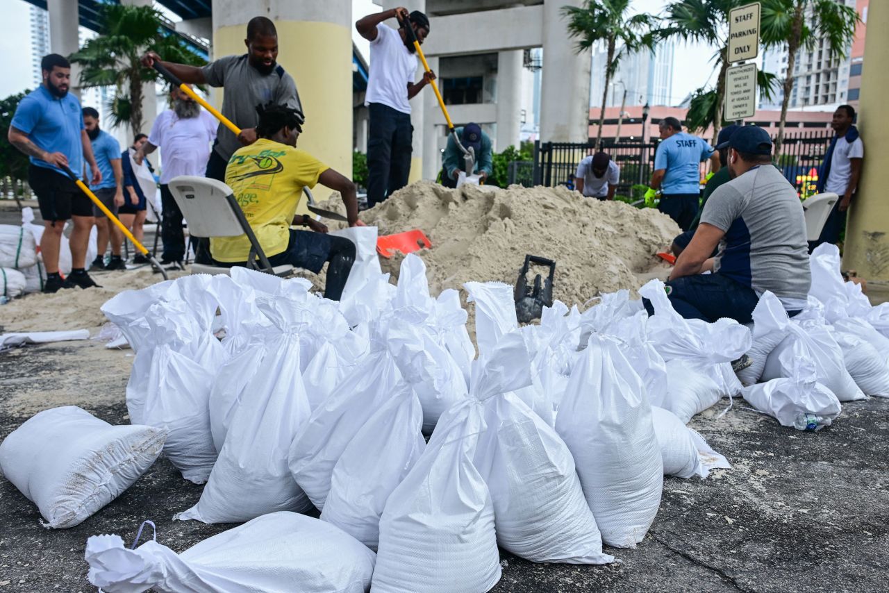 Volunteers from the city of Miami fill sandbags to help residents prepare for the arrival of Hurricane Milton in Miami on October 7.