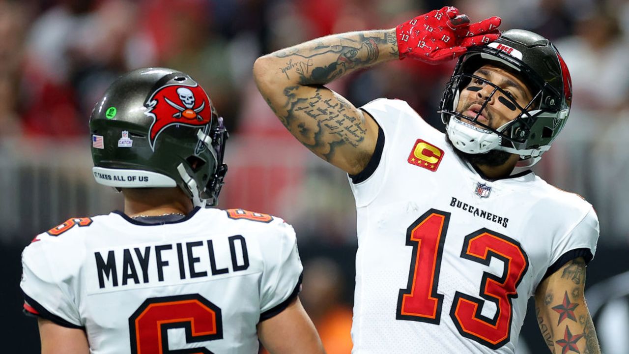 ATLANTA, GEORGIA - OCTOBER 03: Mike Evans #13 of the Tampa Bay Buccaneers celebrates with Baker Mayfield #6 after scoring a touchdown against the Atlanta Falcons during the second quarter at Mercedes-Benz Stadium on October 03, 2024 in Atlanta, Georgia. (Photo by Kevin C. Cox/Getty Images)