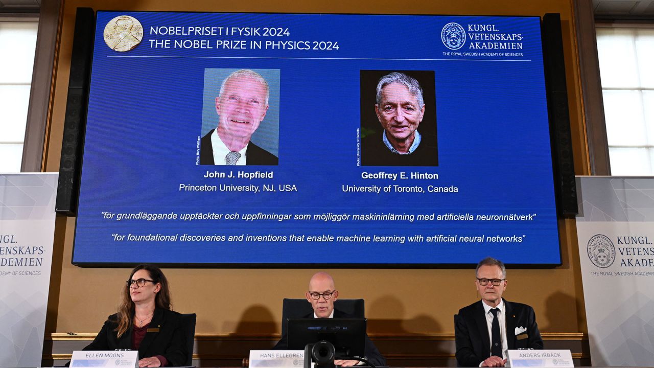 A screen shows the laureates of the 2024 Nobel Prize in Physics, US physicist John J Hopfield (L) and Canadian-British computer scientist and cognitive psychologist Geoffrey E Hinton, during the announcement at the Royal Swedish Academy of Sciences in Stockholm, Sweden on October 8, 2024. (Photo by Jonathan NACKSTRAND / AFP) (Photo by JONATHAN NACKSTRAND/AFP via Getty Images)