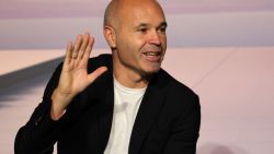 Spanish footballer Andres Iniesta gestures as he announces his retirement aged 40 during an event to celebrate his career at the America's Cup Experience venue in Barcelona on October 8, 2024. Andres Iniesta scored the most important goal in the history of Spanish football, winning his country the World Cup for the first time in 2010. Iniesta came through Barcelona's La Masia youth academy, joining the club aged 12, departing 22 years later to join Japanese club Vissel Kobe before spending last season at Emirates in the United Arab Emirates. (Photo by LLUIS GENE / AFP) (Photo by LLUIS GENE/AFP via Getty Images)