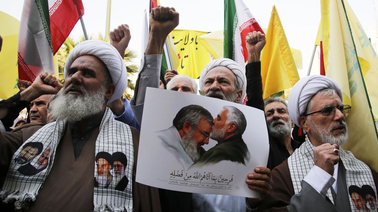 People holding banners and flags gather to stage a demonstration against Israeli attacks in Lebanon and Gaza, in Tehran, Iran, on October 8.