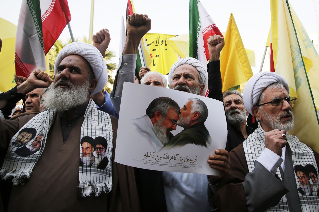 People holding banners and flags gather to stage a demonstration against Israeli attacks in Lebanon and Gaza, in Tehran, Iran, on October 8.