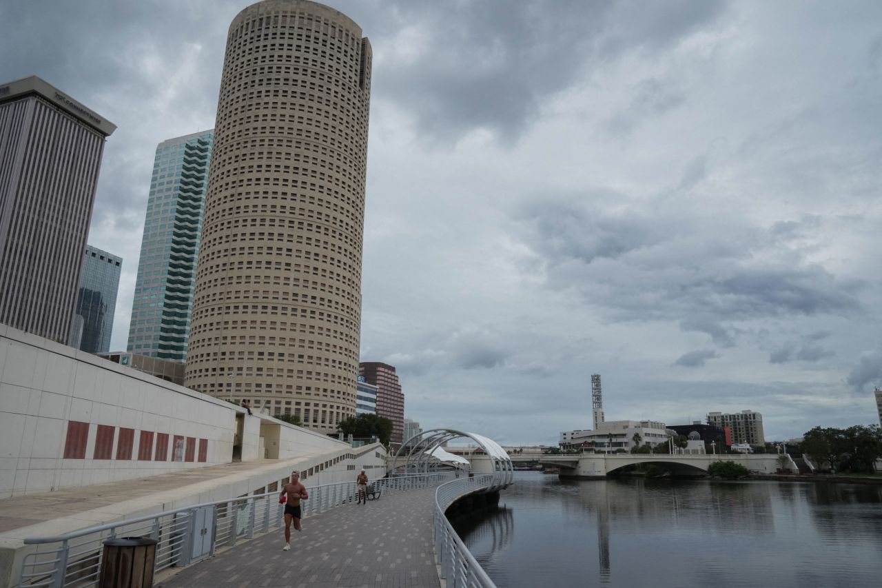 A man jogs on the Tampa Riverwalk in Florida on Tuesday.