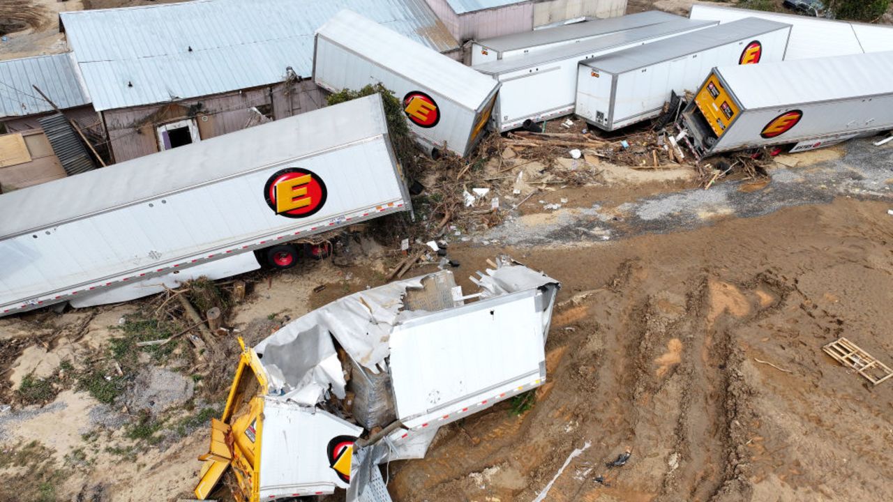 ASHEVILLE, NORTH CAROLINA - OCTOBER 04: An aerial view of flood damage to tractor trailers wrought by Hurricane Helene along the Swannanoa River on October 4, 2024 in Asheville, North Carolina. At least 215 people were killed in six states in the wake of the powerful hurricane which made landfall as a Category 4. President Joe Biden ordered the deployment of 1,000 active duty U.S. soldiers to assist with storm relief efforts in what is now the deadliest U.S. mainland hurricane since Hurricane Katrina.  (Photo by Mario Tama/Getty Images)