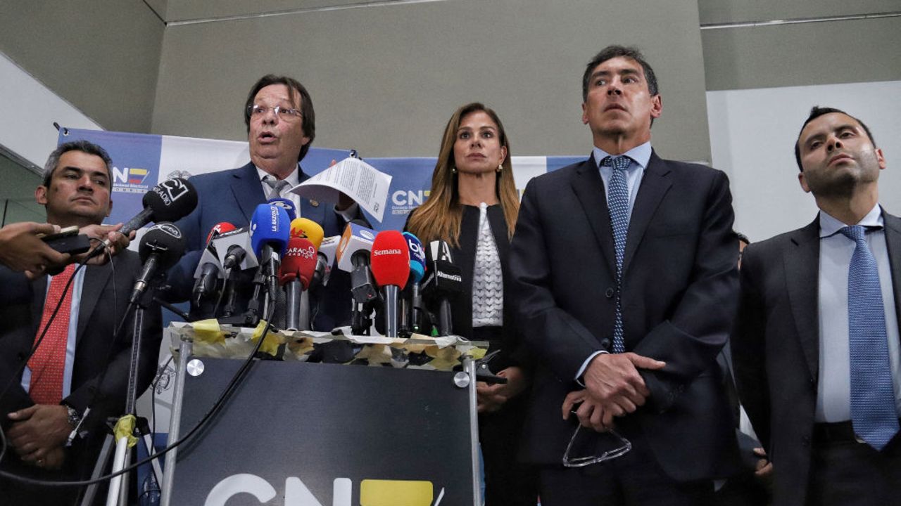 The president of the National Electoral Council (CNE) of Colombia, Cesar Lorduy (2nd L), speaks during a press conference in Bogota on October 8, 2024. Colombia's electoral authority opened an administrative investigation on Tuesday into possible overspending on President Gustavo Petro's campaign accounts for the 2022 presidential election, a decision described by Petro as an attempted "coup d'état." (Photo by Andrea ARIZA / AFP) (Photo by ANDREA ARIZA/AFP via Getty Images)