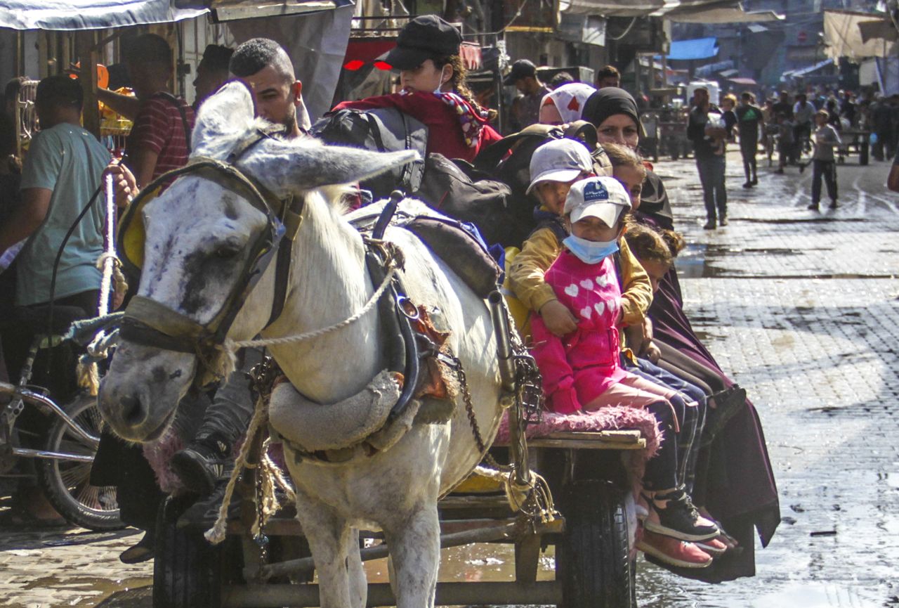 Palestinian residents of the Jabalya Refugee Camp flee to other areas, with the belongings they could carry, following Israeli attacks on the camp in Gaza City, Gaza on October 1, 2024.