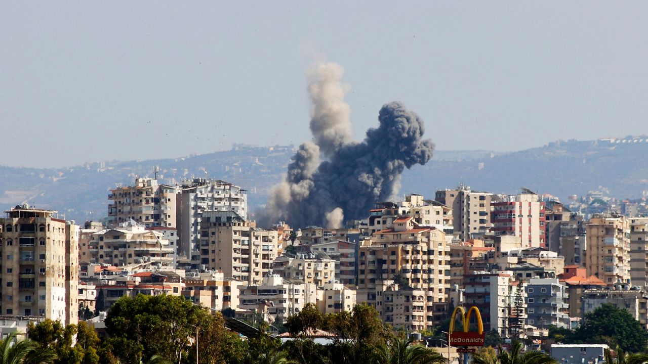 A smoke cloud erupts following an Israeli air strike on a village near Lebanon's southern city of Tyre on October 9.