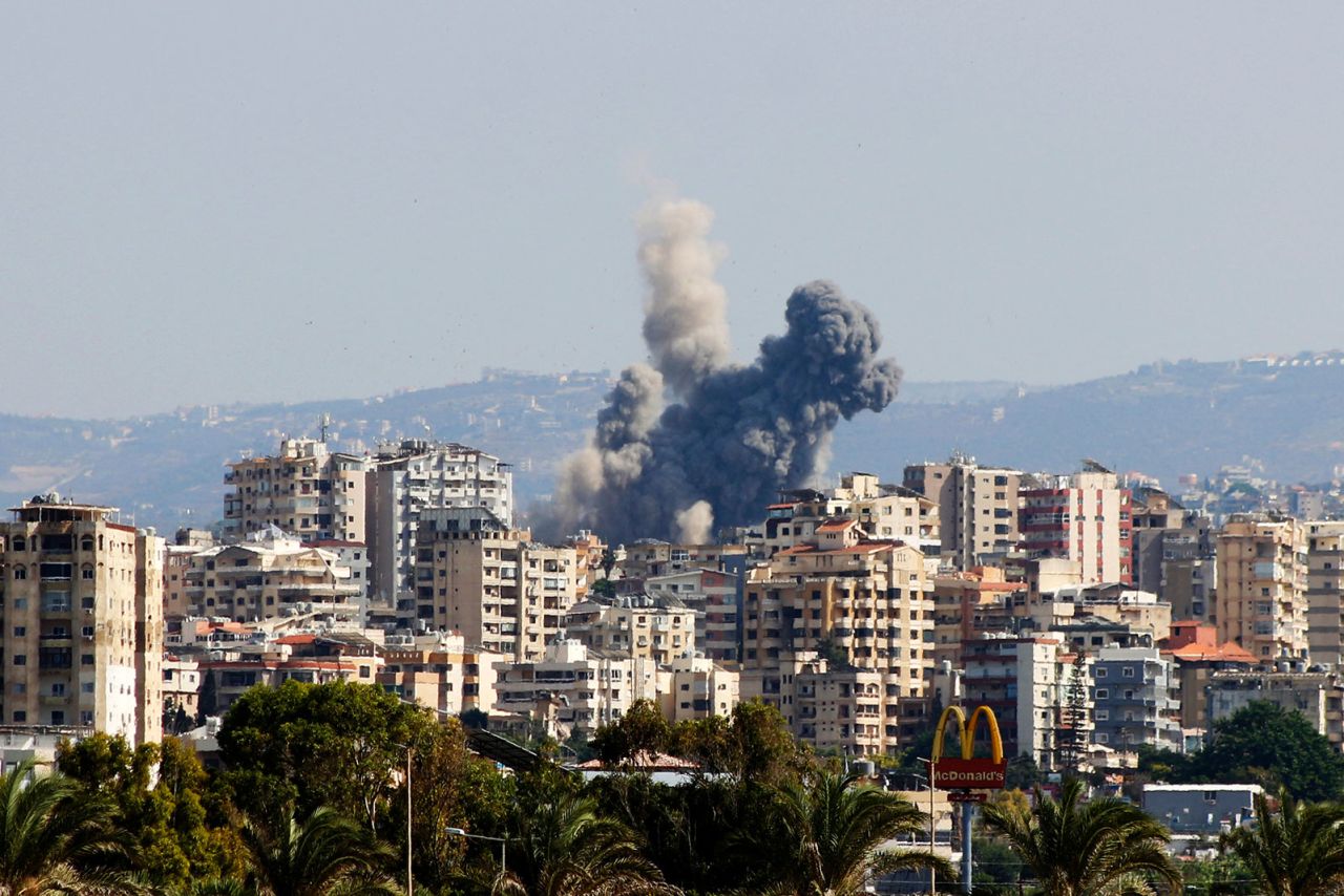 A smoke cloud erupts following an Israeli air strike on a village near Lebanon's southern city of Tyre on October 9.