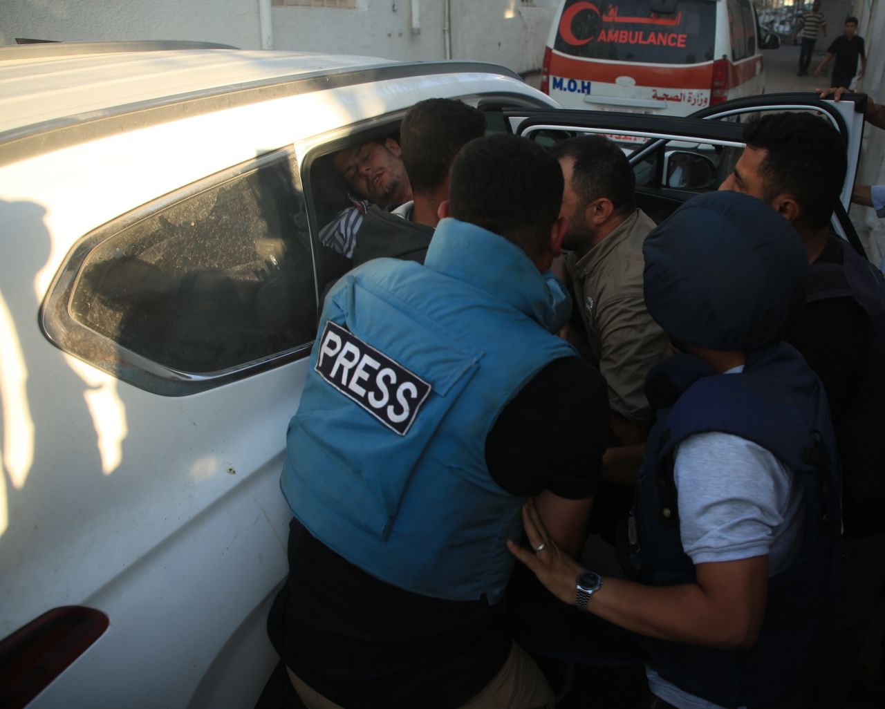 Al Jazeera cameraman Fadi al-Wahidi is carried to Al Ahly Hospital after being injured from gunfire in Gaza on October 9.