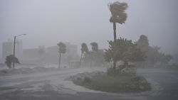 TOPSHOT - A car is seen parked as it rains heavily in Fort Myers, Florida, on October 9, 2024 as Hurricane Milton approaches. Milton regained power on October 8 to become a Category 5 storm with maximum sustained winds of 165 mph (270 kph) as it barrels towards the west-central coast of Florida and is forecast to make landfall late October 9, according to the National Hurricane Center. (Photo by CHANDAN KHANNA / AFP) (Photo by CHANDAN KHANNA/AFP via Getty Images)