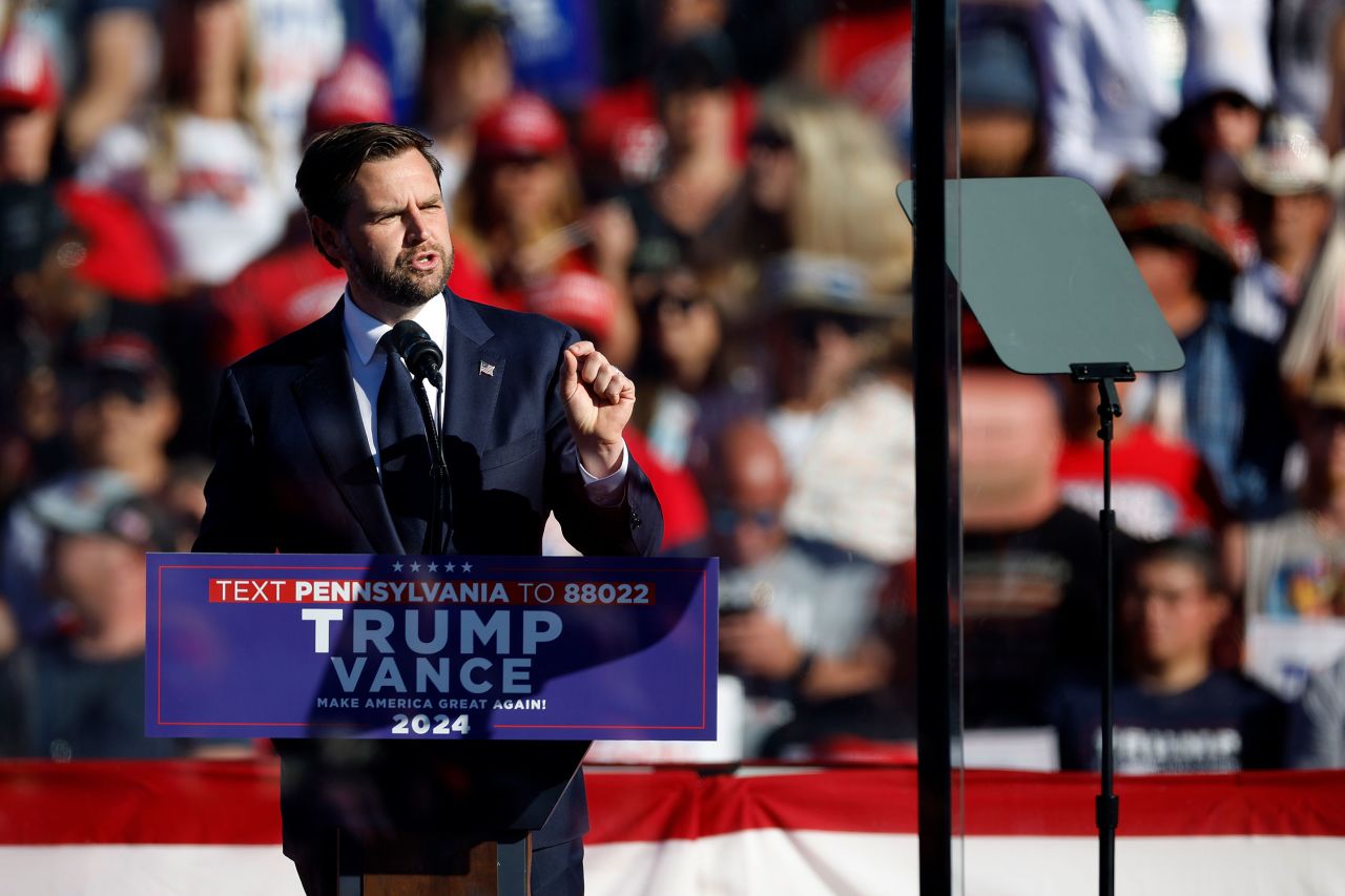 Republican vice presidential nominee JD Vance speaks from behind bullet resistant glass at a campaign rally in Butler, Pennsylvania, on Saturday.