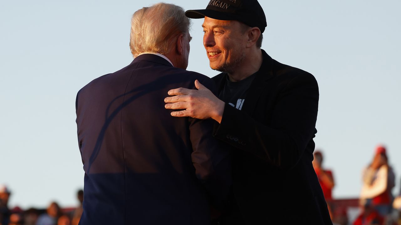 BUTLER, PENNSYLVANIA - OCTOBER 05: Elon Musk embraces Republican presidential nominee, former President Donald Trump during a campaign rally at the Butler Farm Show fairgrounds on October 05, 2024 in Butler, Pennsylvania. This is the first time that Trump has returned to Butler since he was injured during an attempted assassination on July 13.  (Photo by Anna Moneymaker/Getty Images)