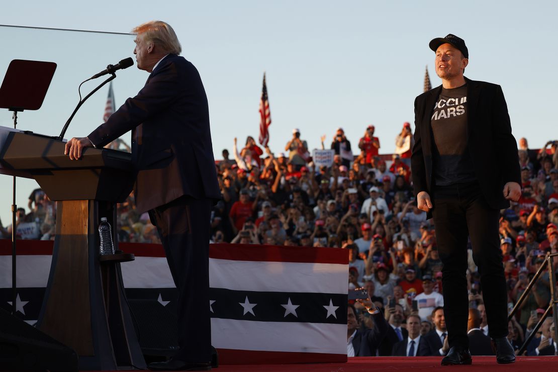 Elon Musk takes the stage as Republican presidential candidate, former President Donald Trump speaks at a campaign rally in Butler, Pennsylvania, on October 5.