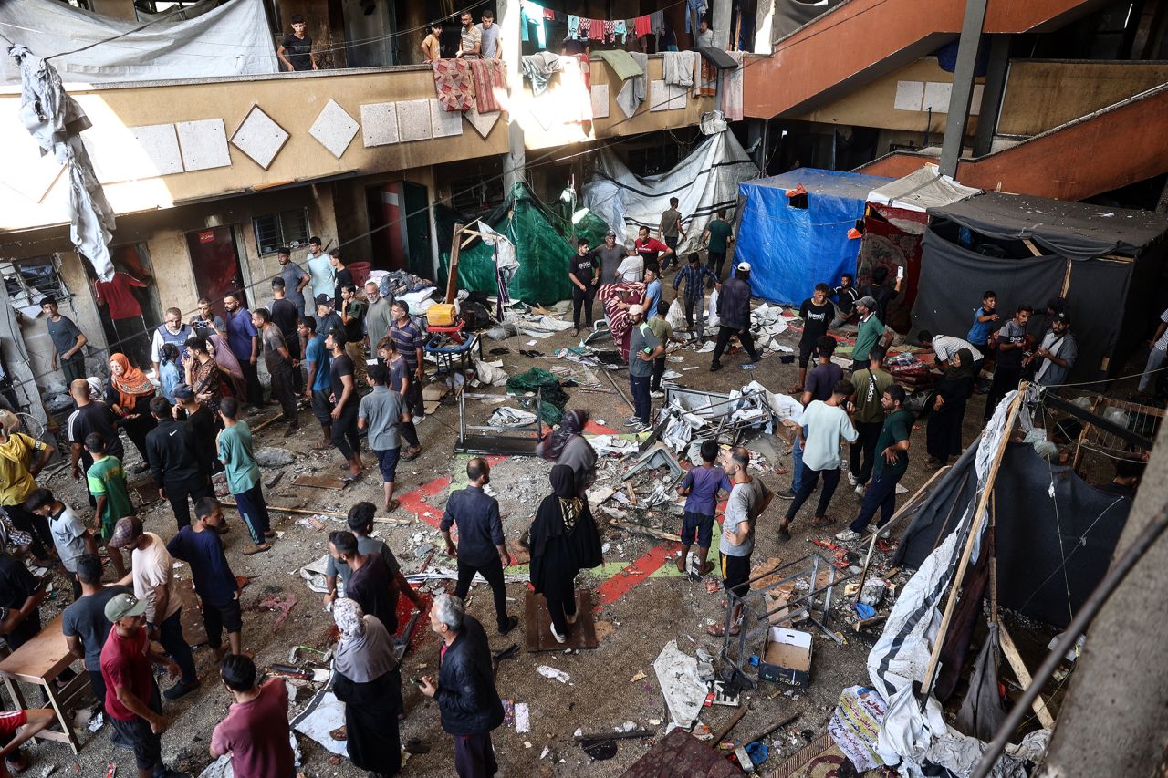 Palestinians react after an Israeli strike hit the Rafida school housing displaced people in Deir al-Balah in the central Gaza Strip, on October 10, 2024, amid the ongoing war between Israel and Hamas.