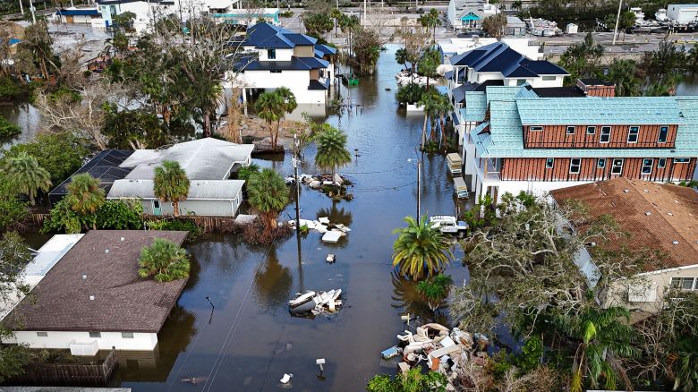 A drone image shows a flooded street due to Hurricane Milton in Siesta Key, Florida, on October 10, 2024. At least four people were confirmed killed as a result of two tornadoes triggered by Hurricane Milton on the east coast of the US state of Florida, local authorities said Thursday. (Photo by Miguel J. Rodriguez Carrillo / AFP) (Photo by MIGUEL J. RODRIGUEZ CARRILLO/AFP via Getty Images)