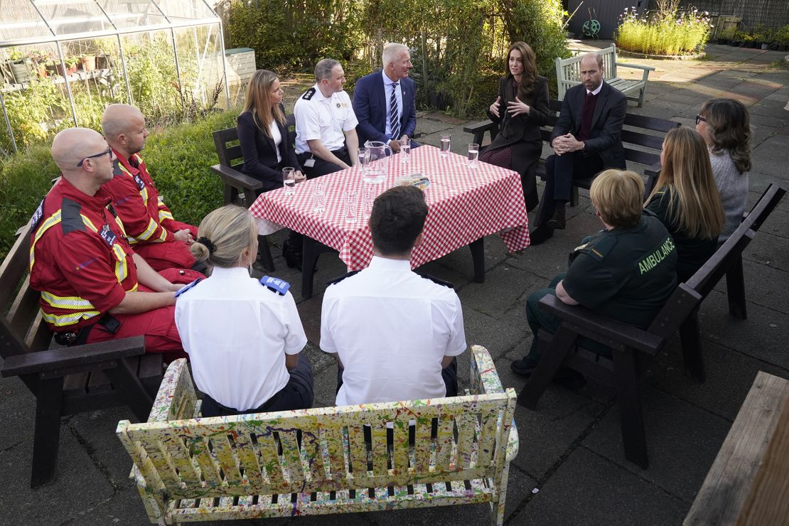 William and Kate speak to members of the emergency service during a visit to the Southport Community Center in Southport, northwest England, on Thursday.