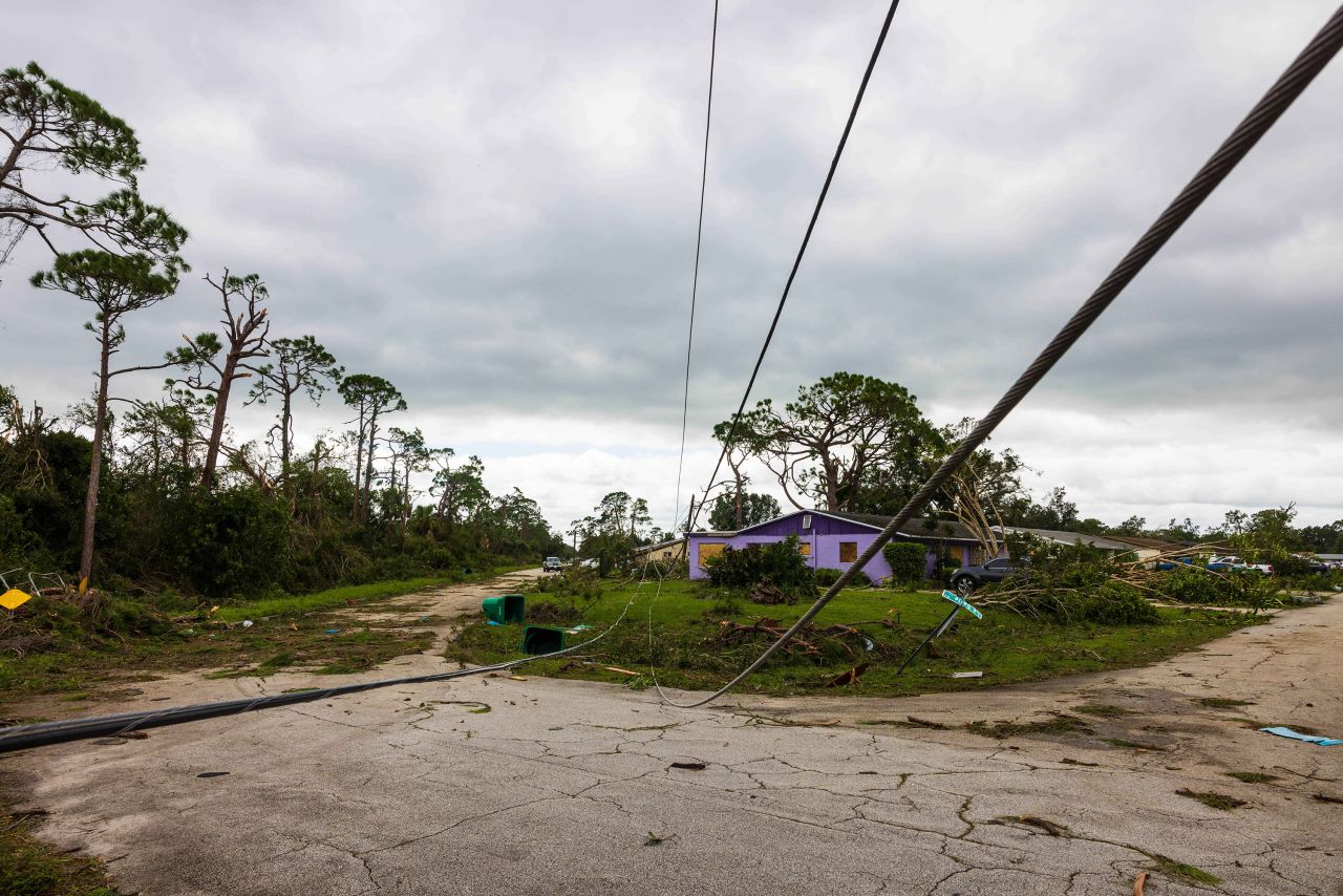 Downed power lines lie on the ground in Port St. Lucie, Florida, on October 10.