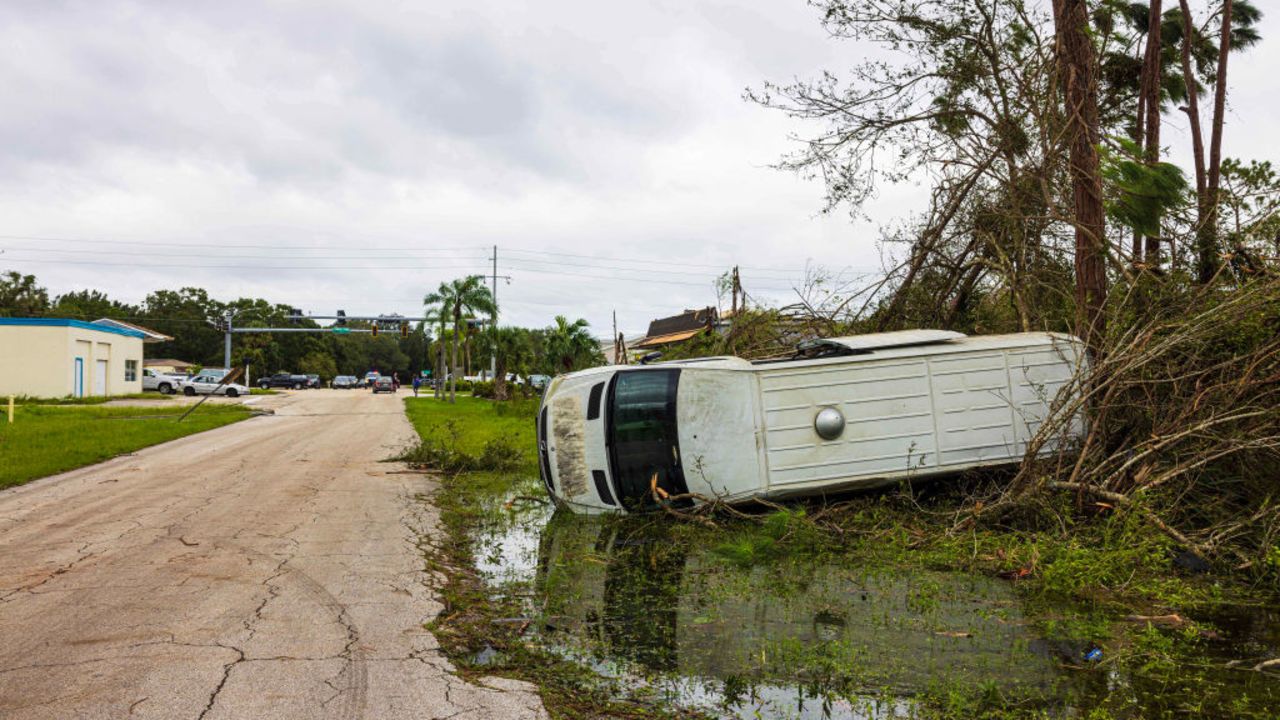 PORT ST LUCIE, FLORIDA - OCTOBER 10: A vehicle left damaged by a tornado caused by Hurricane Milton, on October 10, 2024 in Port St Lucie, Florida. The storm made landfall as a Category 3 hurricane in the Siesta Key area of Florida, causing damage and flooding throughout Central Florida. (Photo by Saul Martinez/Getty Images)