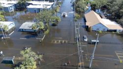 A drone image of a Sheriff's Department vehicle moving through flooded streets in Tampa due to Hurricane Milton on October 10, 2024 in Florida. Hurricane Milton tore a coast-to-coast path of destruction across the US state of Florida, whipping up a spate of deadly tornadoes that left at least four people dead, but avoiding the catastrophic devastation officials had feared. (Photo by Bryan R. SMITH / AFP) (Photo by BRYAN R. SMITH/AFP via Getty Images)