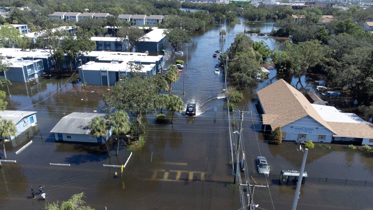 A police vehicle moving through flooded streets in Tampa, Florida, on Thursday.