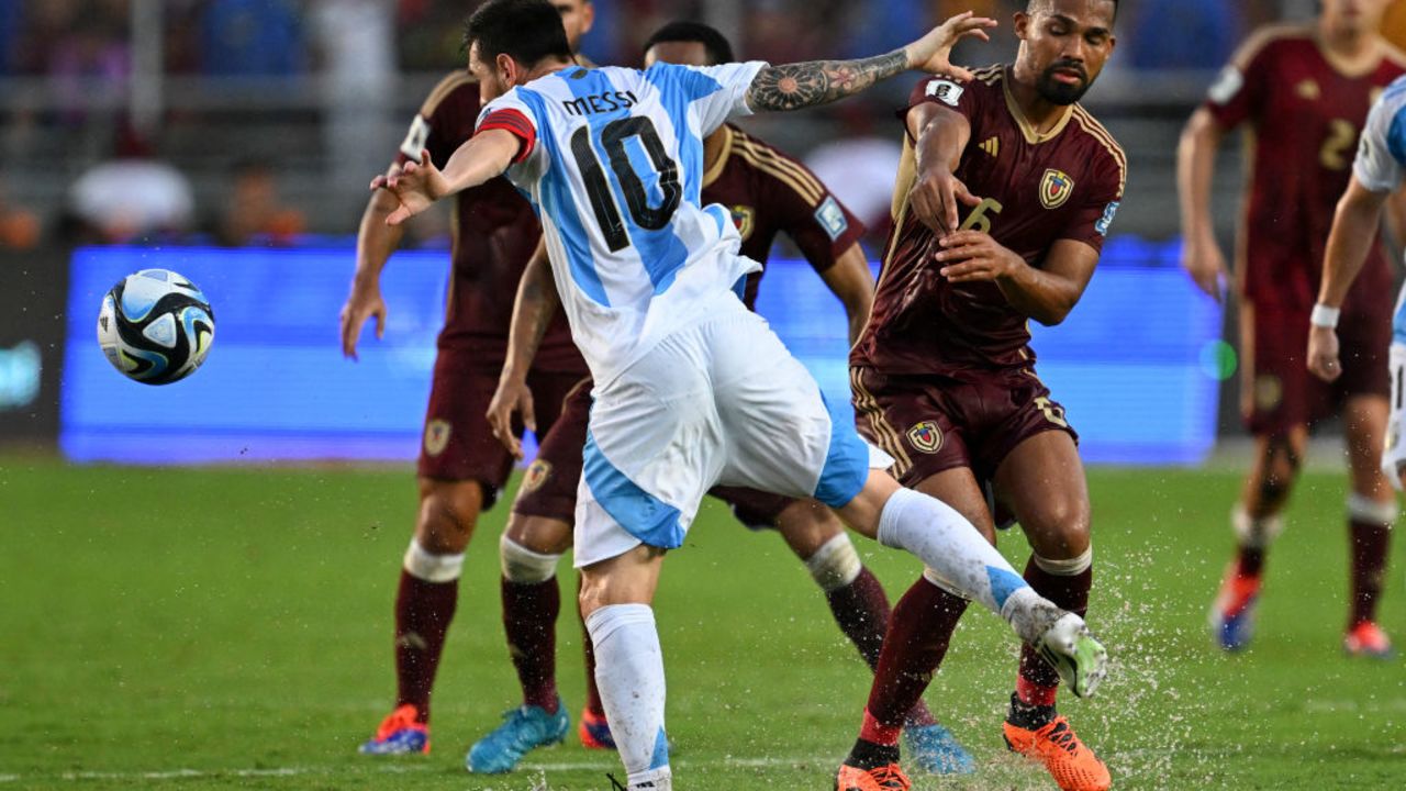 Argentina's forward Lionel Messi (L) and Venezuela's midfielder Yangel Herrera fight for the ball during the 2026 FIFA World Cup South American qualifiers football match between Venezuela and Argentina, at the Monumental de Maturin stadium in Maturin, Venezuela, on October 10, 2024. (Photo by JUAN BARRETO / AFP) (Photo by JUAN BARRETO/AFP via Getty Images)