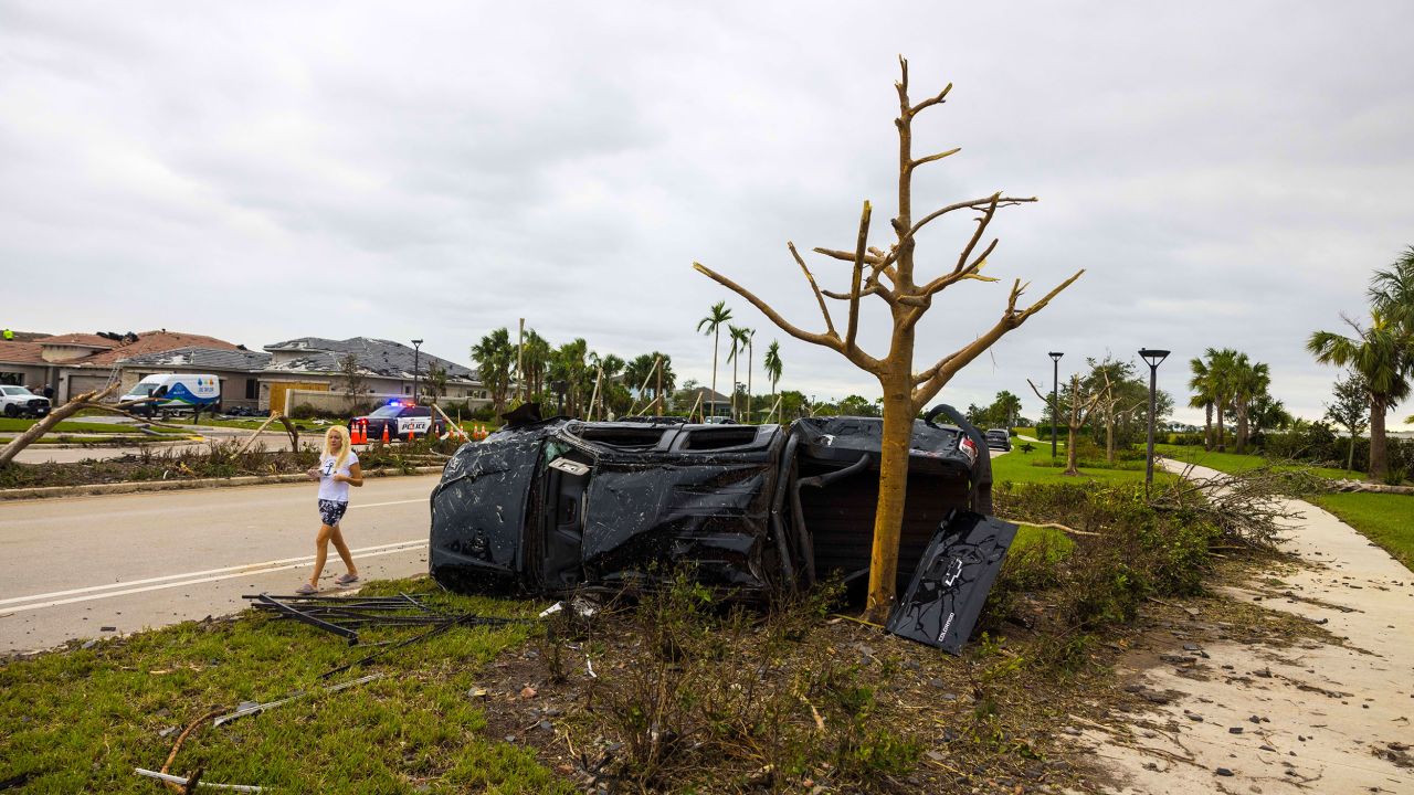 A car flipped onto its side is seen on October 10 in Palm Beach Gardens, Florida.