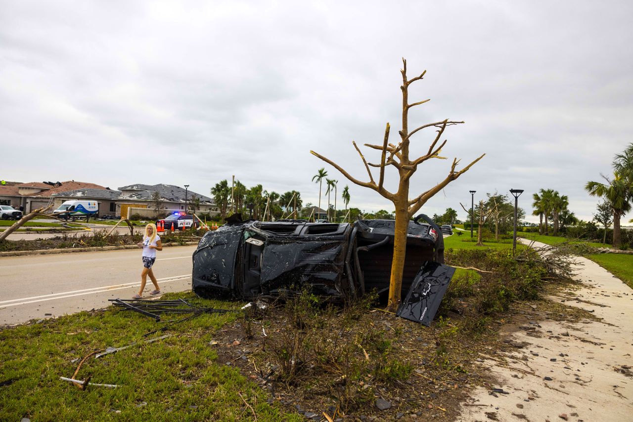 A car flipped onto its side is seen on October 10 in Palm Beach Gardens, Florida.