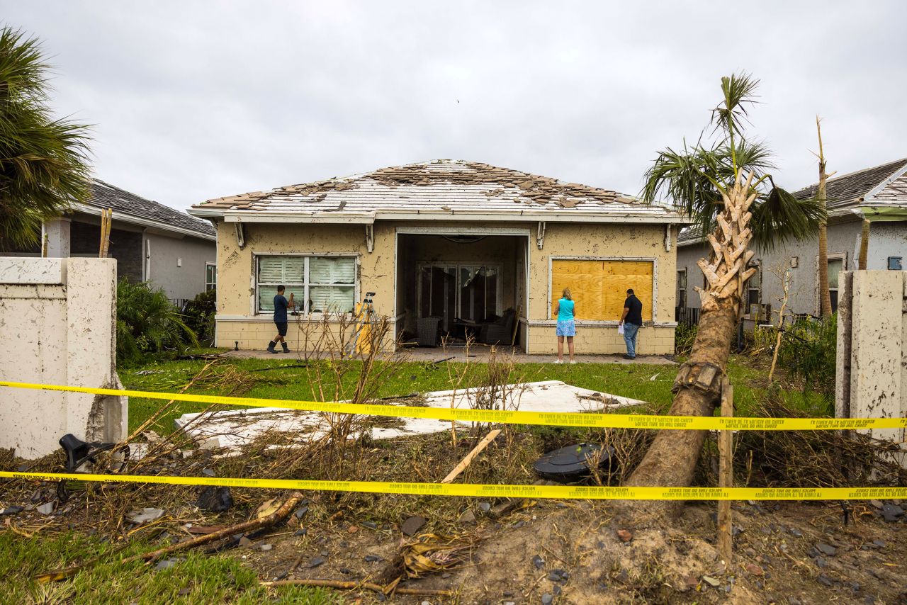 A damaged home is seen on October 10, in Palm Beach Gardens, Florida.