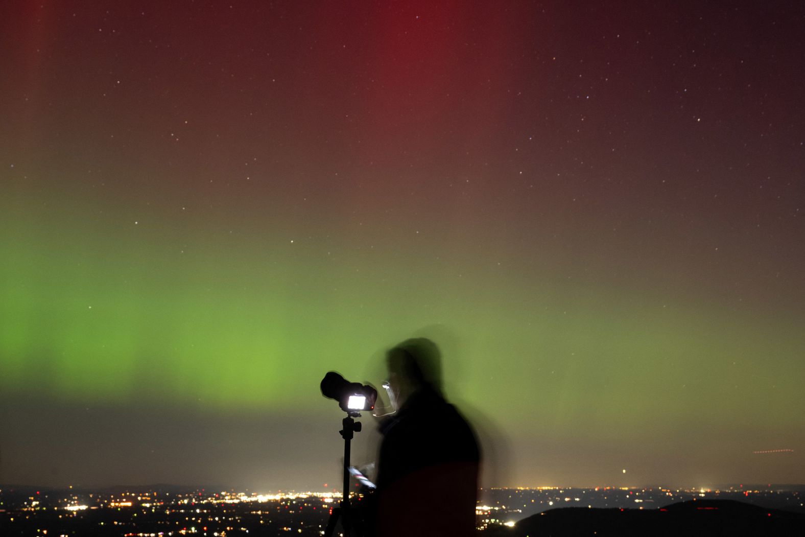 A photographer takes pictures of the northern lights in Shenandoah National Park in Rileyville, Virginia, on Thursday.