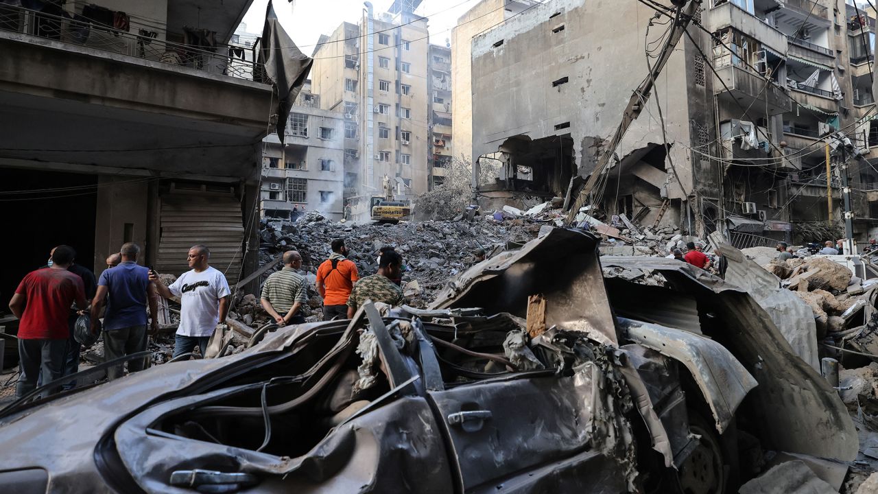 People gather at the site of an Israeli airstrike in Beirut, Lebanon, on October 11.