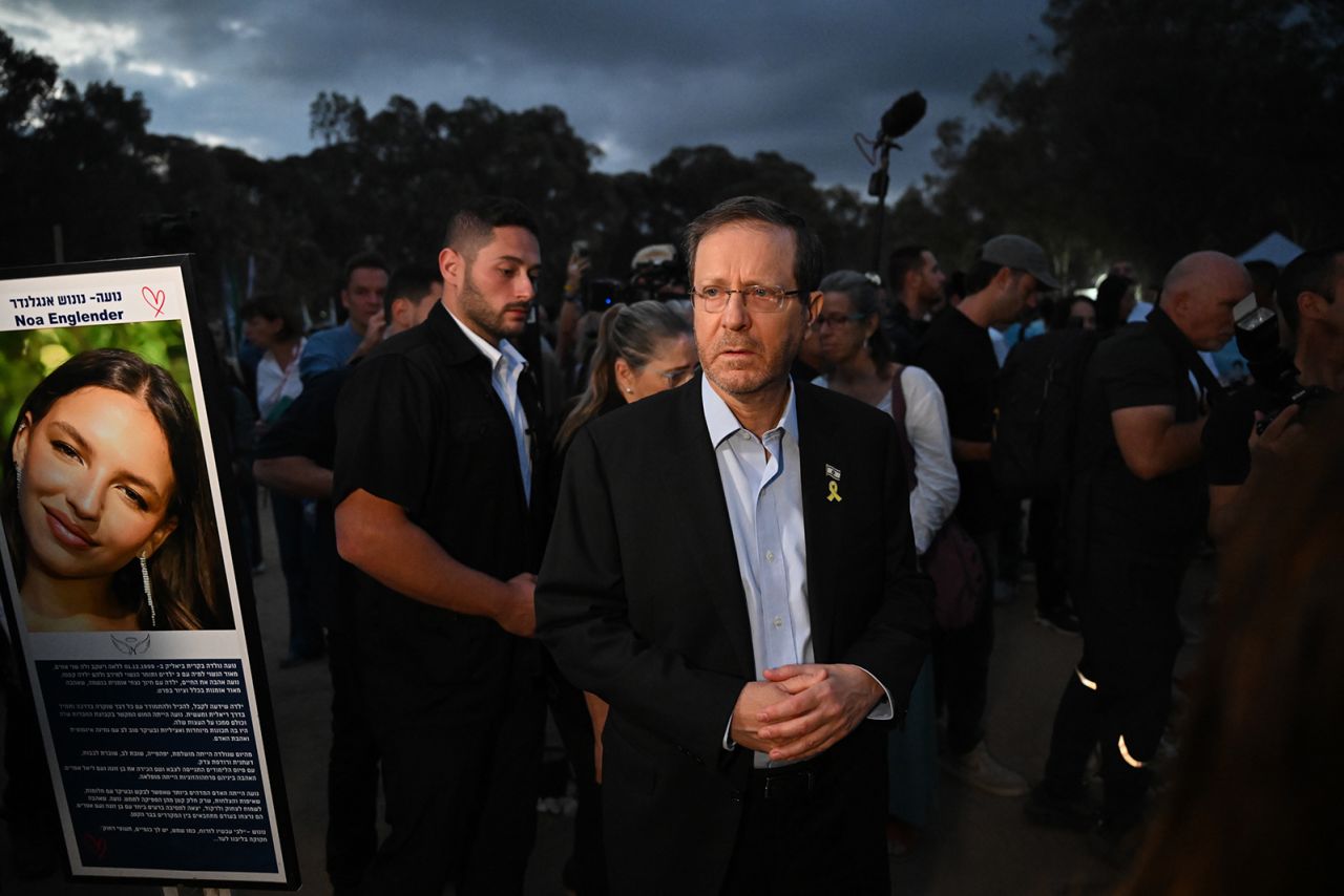 The President of Israel Isaac Herzog and his wife visit relatives of victims and attend the one year memorial ceremony at the Nova festival memorial to mark one the first anniversary since Hamas attacked one year ago, in Re’im, Israel, on October 7.