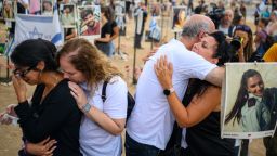 RE'IM, ISRAEL - OCTOBER 07: Family and friends gather at the Nova festival memorial to mark the first anniversary since Hamas attacked one year ago on October 07, 2024 in Re'im, Israel. Various commemorations are taking place around Israel to mark the  anniversary of the Hamas attacks in Israel. On October 7, 2023, members of Hamas mounted a series of attacks and raids on Israeli citizens in the Gaza Envelope border area of Israel. 251 Israelis and foreigners were kidnapped with nearly 100 still unaccounted for and 1139 people were killed. (Photo by Alexi J. Rosenfeld/Getty Images)