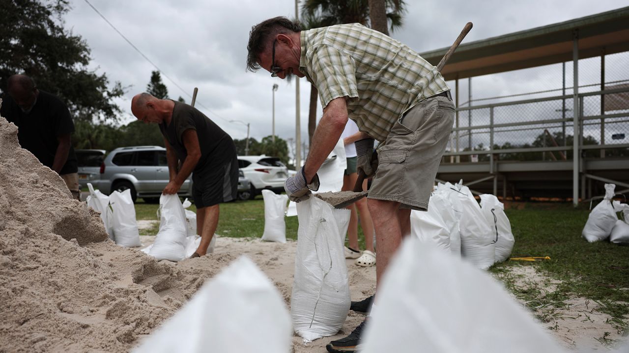 People fill sandbags as the state prepares for the arrival of Hurricane Milton on October 7, in St. Petersburg, Florida.