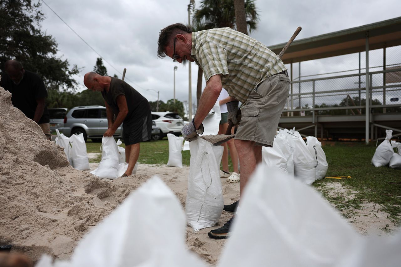 People fill sandbags as the state prepares for the arrival of Hurricane Milton on October 7, in St. Petersburg, Florida.