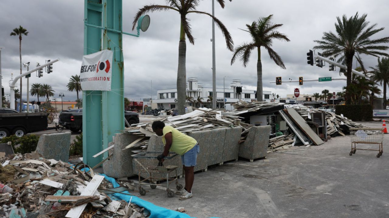 TREASURE ISLAND, FLORIDA - OCTOBER 07: People continue to clean up from the previous storm as preparations are made for Hurricane Milton's arrival on October 07, 2024, in Treasure Island, Florida. Milton, which came just after the recent catastrophic hurricane Helene, has strengthened to a Category 5 storm as it approaches Florida’s Gulf Coast and is expected to make landfall midweek.  (Photo by Spencer Platt/Getty Images)