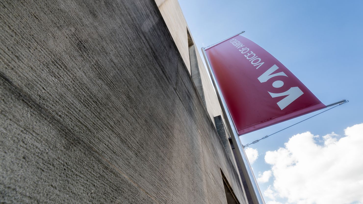 A banner hangs on the side of the Voice of America (VOA) headquarters building in Washington, DC.