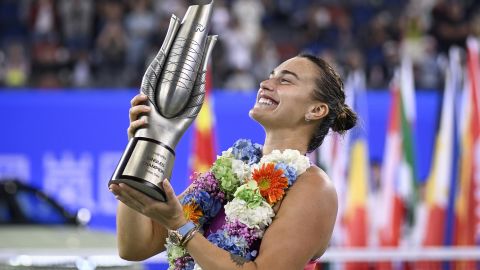 Belarus' Aryna Sabalenka poses with the trophy after winning the women's singles final against China's Zheng Qinwen at the Wuhan Open tennis tournament in Wuhan, China's Hubei province on October 13, 2024. (Photo by WANG Zhao / AFP) (Photo by WANG ZHAO/AFP via Getty Images)