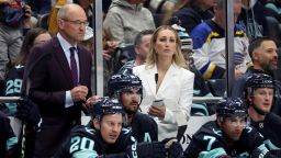 SEATTLE, WASHINGTON - OCTOBER 08: Head coach Dan Bylsma and assistant coach Jessica Campbell of the Seattle Kraken look on during the first period against the St. Louis Blues at Climate Pledge Arena on October 08, 2024 in Seattle, Washington. Campbell is the first woman to coach in the NHL. (Photo by Steph Chambers/Getty Images)
