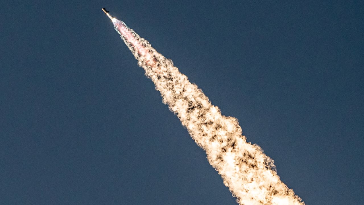 TOPSHOT - The SpaceX Starship lifts off from Starbase near Boca Chica, Texas, on October 13, 2024, for the Starship Flight 5 test. SpaceX successfully "caught" the first-stage booster of its Starship megarocket Sunday as it returned to the launch pad after a test flight, a world first in the company's quest for rapid reusability. (Photo by SERGIO FLORES / AFP) (Photo by SERGIO FLORES/AFP via Getty Images)