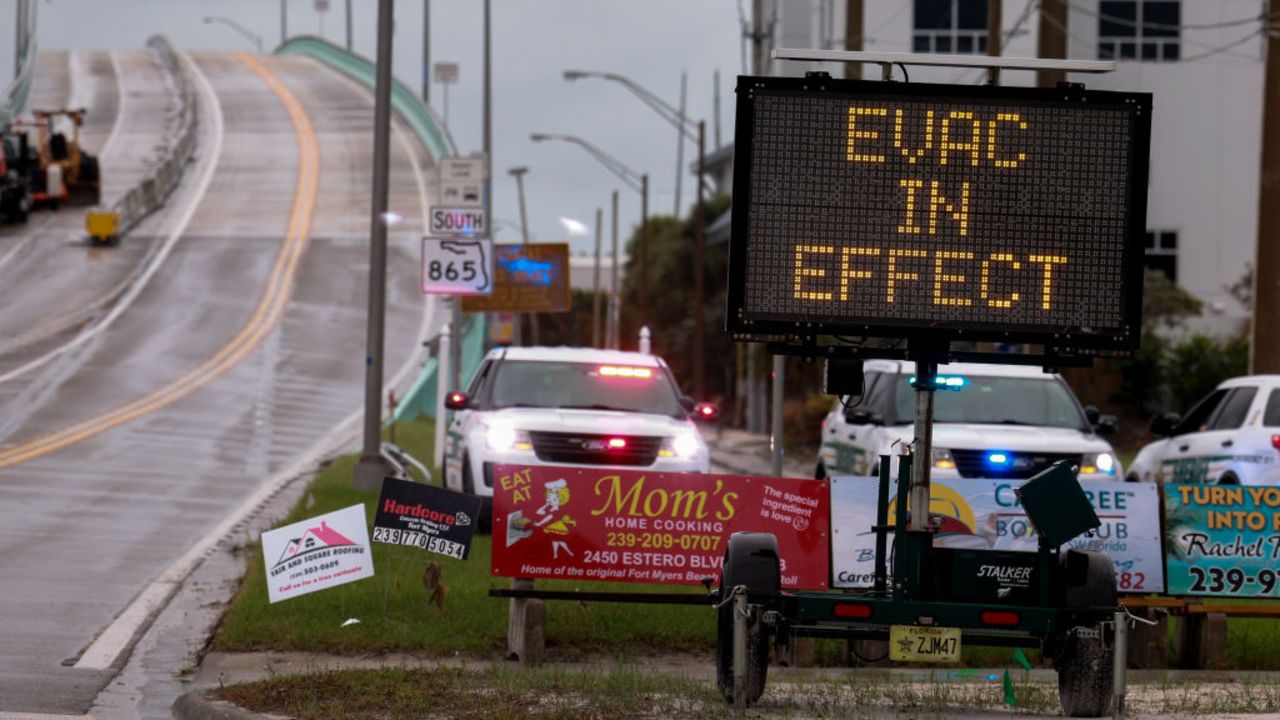 FORT MYERS, FLORIDA - OCTOBER 08: A sign indicates that an evacuation order is in effect for the beach area before Hurricane Milton's arrival on October 08, 2024, in Fort Myers, Florida. People are preparing for the storm, which could be a Cat 3 when it makes landfall on Wednesday evening. (Photo by Joe Raedle/Getty Images)