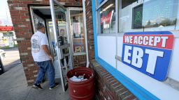 A convenience store advertises that they except EBT cards, Fall River, Massachusetts, October 8.