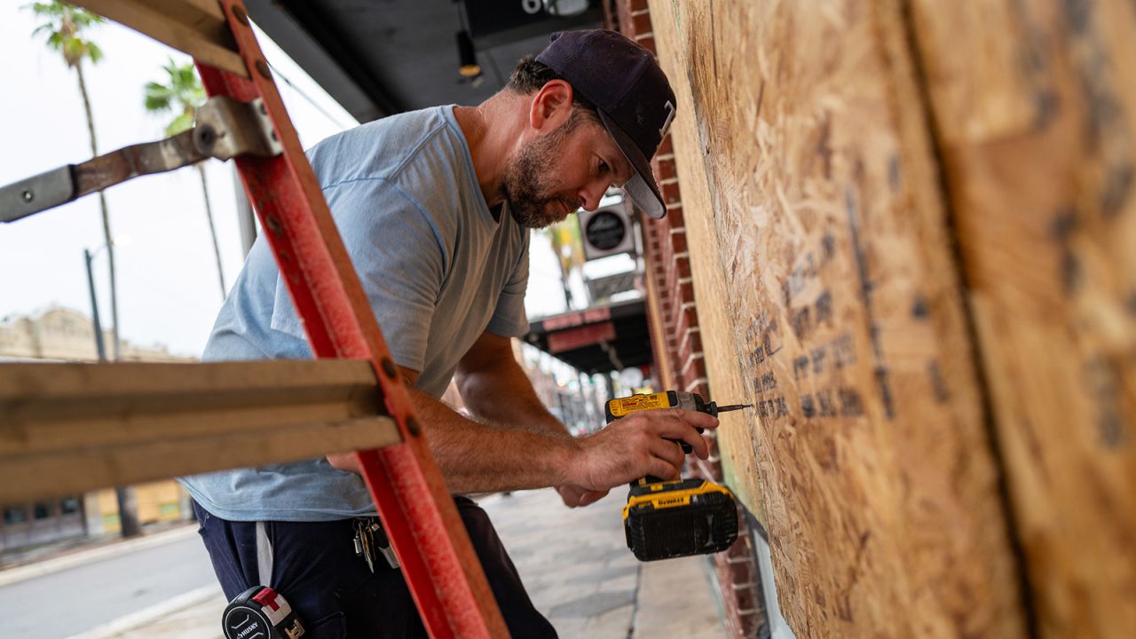 Windows are covered with plywood in the Ybor City neighborhood in Tampa, Florida, as Hurricane Milton approaches on October 08, 2024.