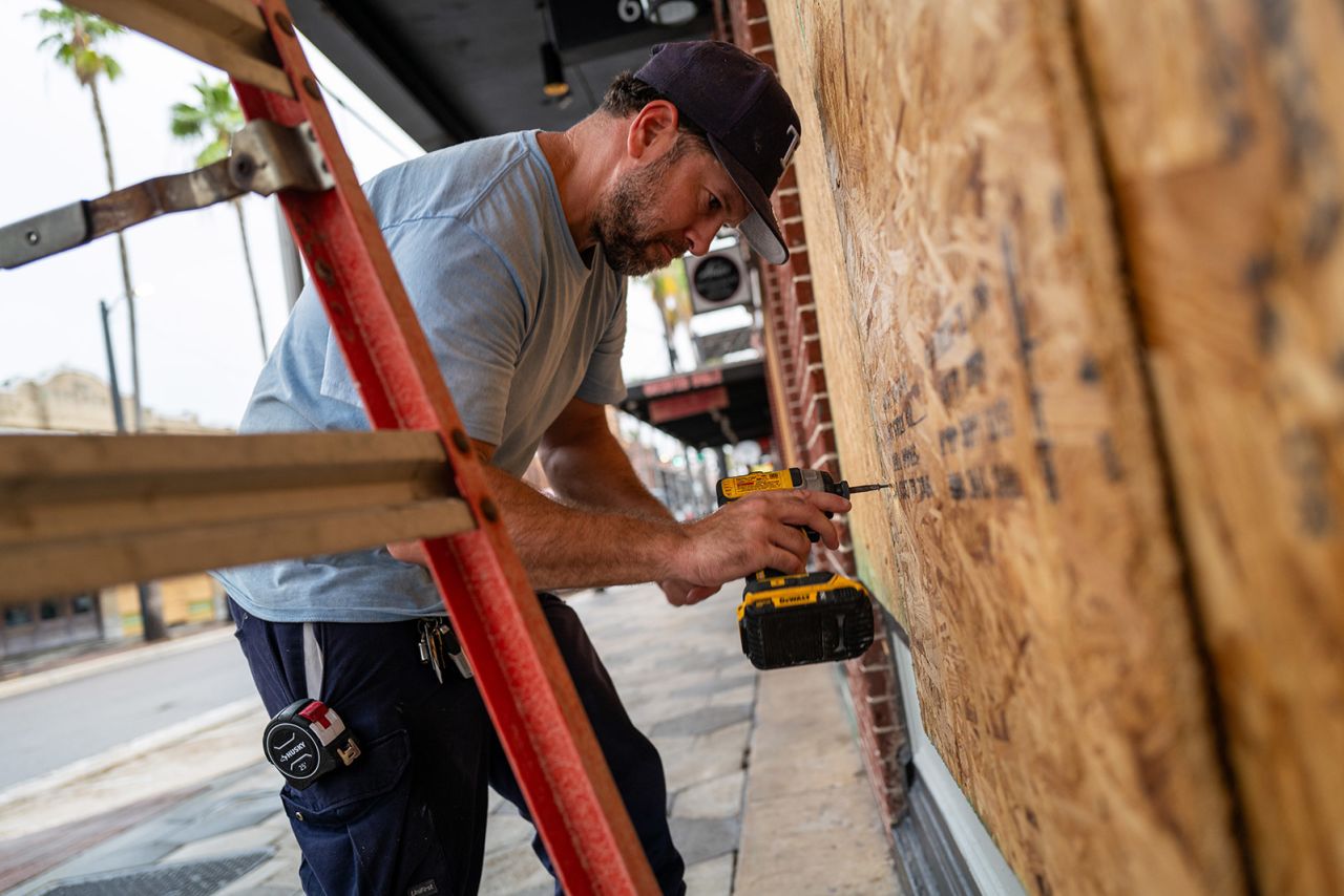 Windows are covered with plywood in the Ybor City neighborhood in Tampa, Florida, as Hurricane Milton approaches on October 08, 2024.