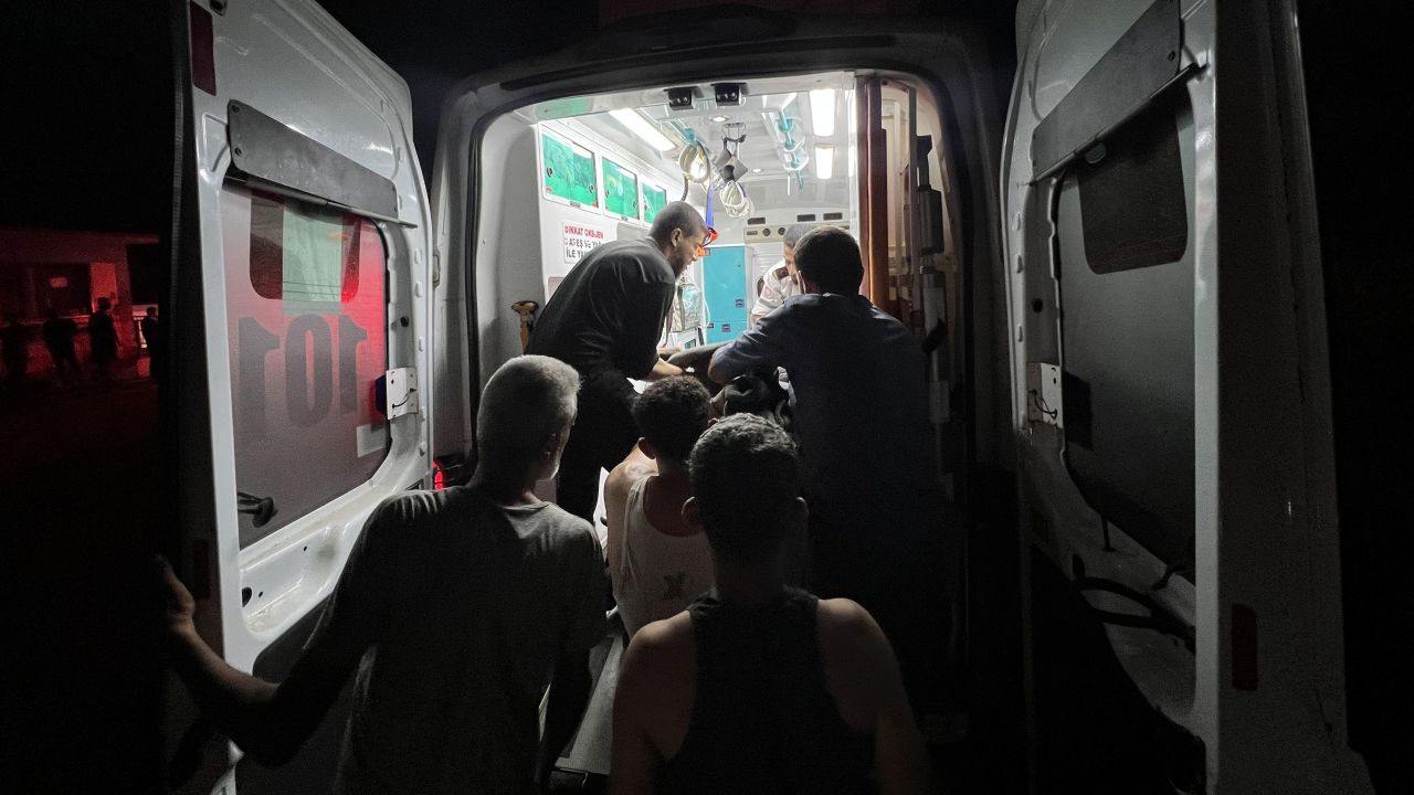 Injured Palestinians are brought to Al Awda hospital after an Israeli strike on Al Mufti school in Gaza's Nuseirat refugee camp on October 13.