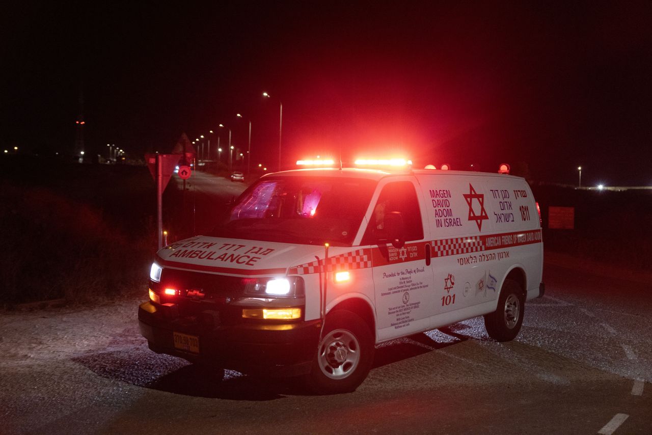 An ambulance leaves the scene of a drone strike near the northern Israeli town of Binyamina on October 13.