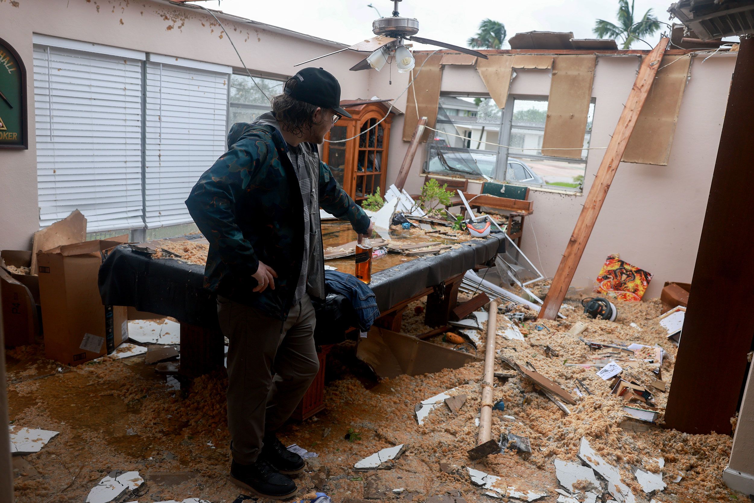 Connor Ferran surveys what is left of his Fort Myers home after what appeared to be a tornado tore the roof off on Wednesday. Milton spawned several tornadoes as it neared landfall.